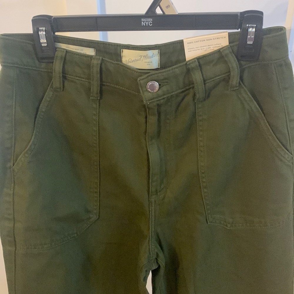 Universal Thread high rise wide leg jeans in a camo green or dark green color.